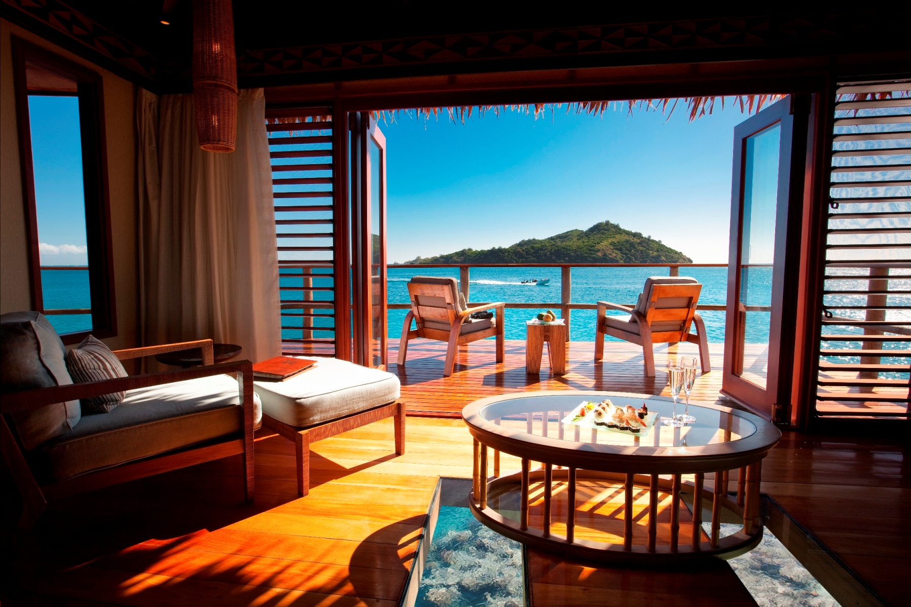 http://thefijivillacompany.com/wp-content/uploads/2014/09/View-from-an-over-water-bure-bed.jpg